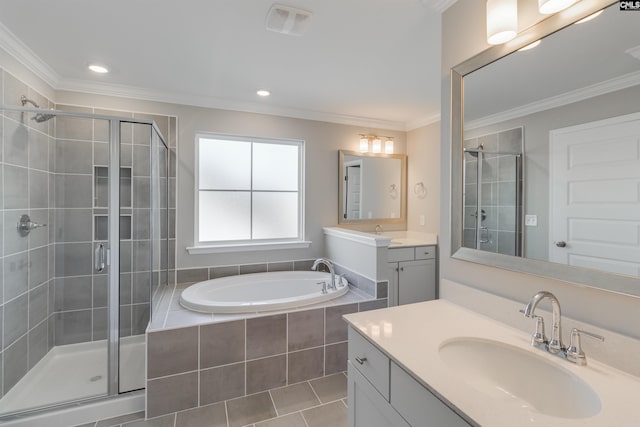 bathroom featuring crown molding, a sink, and a shower stall