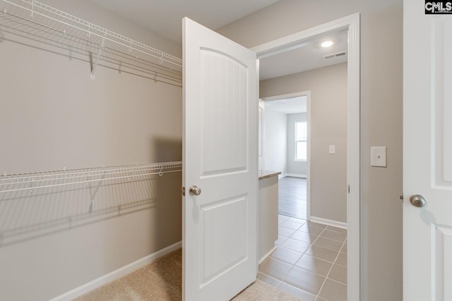 walk in closet featuring light tile patterned floors