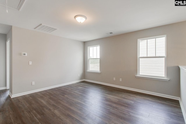 empty room featuring dark wood-type flooring