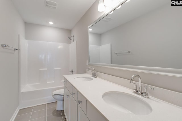 full bathroom featuring toilet, vanity, tile patterned flooring, and shower / bathing tub combination