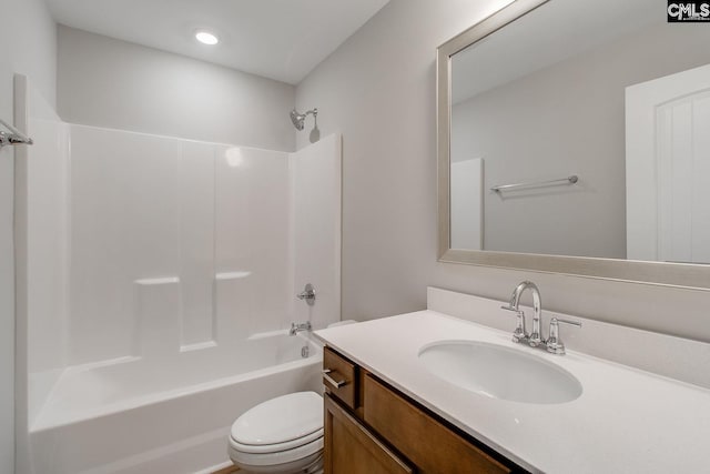 bathroom with toilet, shower / washtub combination, and vanity