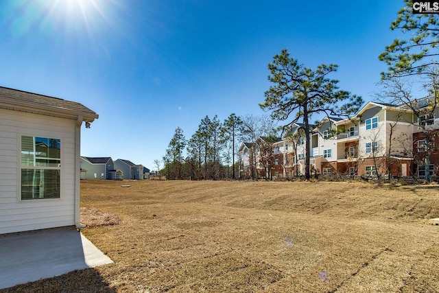 view of yard featuring a residential view