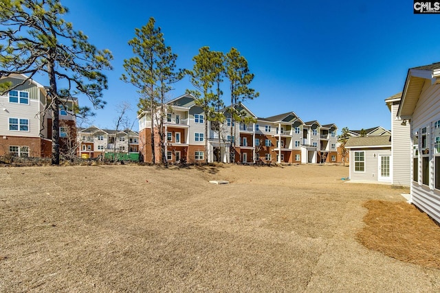 view of yard featuring a residential view