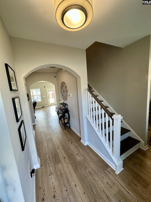 hallway featuring wood-type flooring