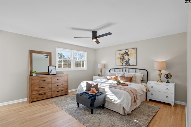 bedroom with ceiling fan and light hardwood / wood-style flooring