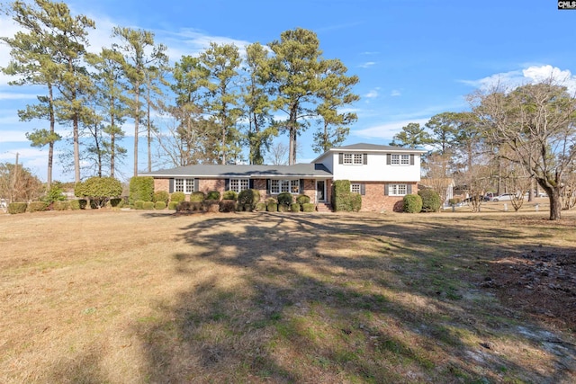 split level home with a front yard