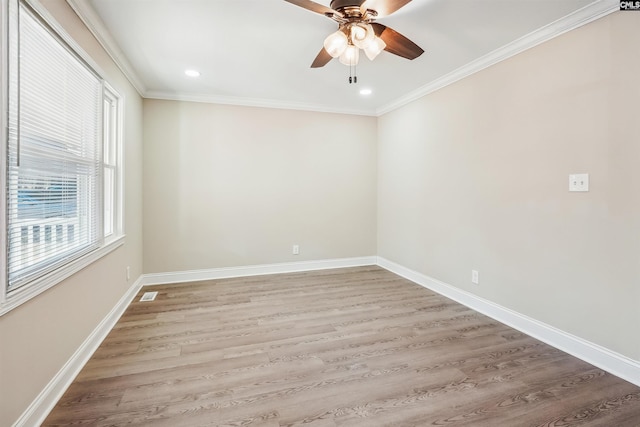 unfurnished room featuring ceiling fan, ornamental molding, and wood-type flooring