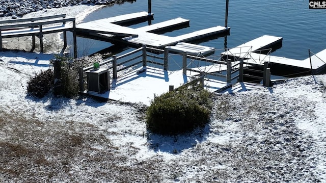 view of dock featuring a water view and cooling unit