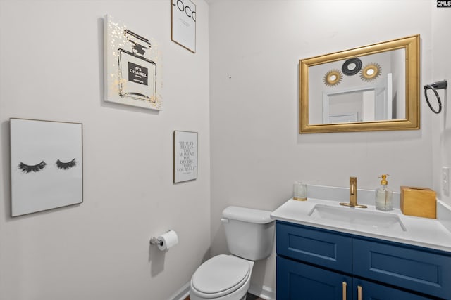 bathroom with toilet and vanity