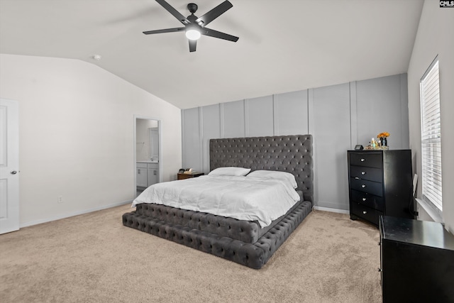 bedroom with ceiling fan, light colored carpet, vaulted ceiling, and multiple windows