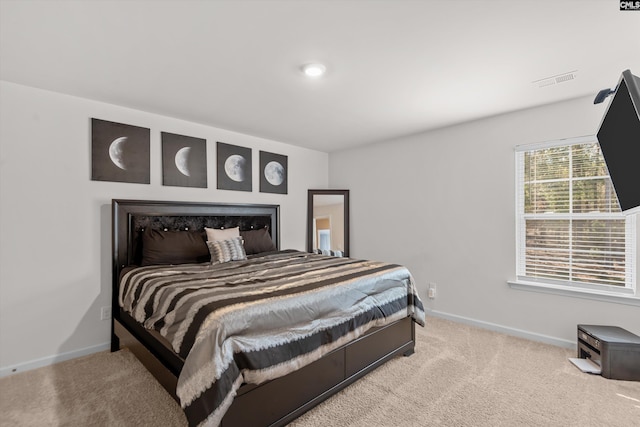 bedroom with light colored carpet