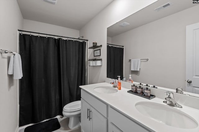 bathroom with toilet and vanity