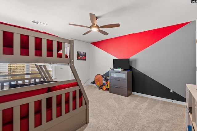 carpeted bedroom with ceiling fan and lofted ceiling