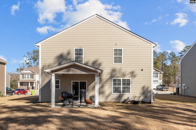 rear view of property featuring a patio area