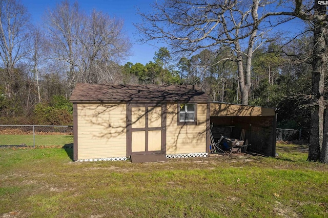 view of outbuilding with a lawn