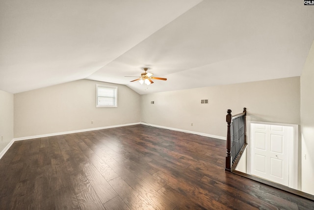 additional living space featuring ceiling fan, dark hardwood / wood-style floors, and lofted ceiling