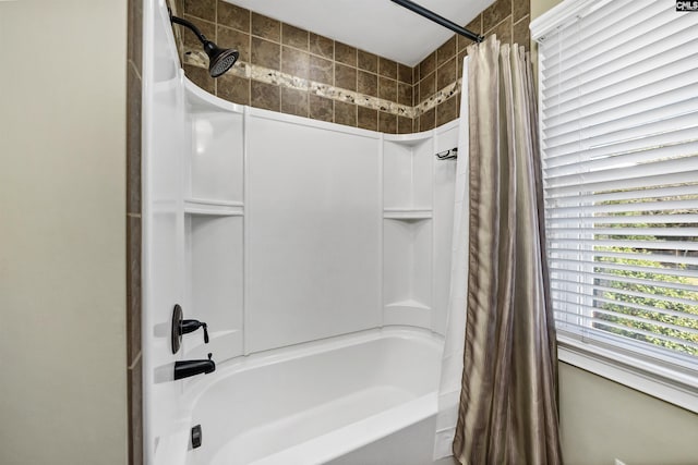 bathroom with shower / tub combo with curtain