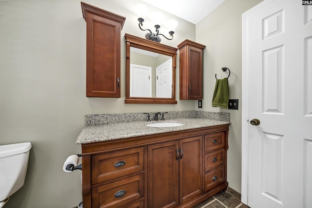 bathroom with toilet and vanity