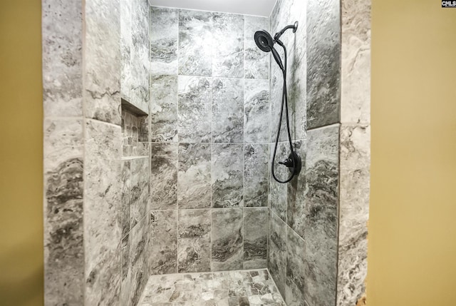 bathroom featuring tiled shower