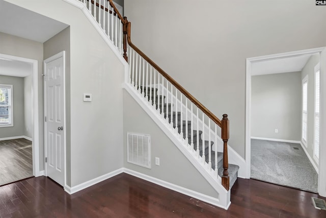 stairway featuring hardwood / wood-style flooring