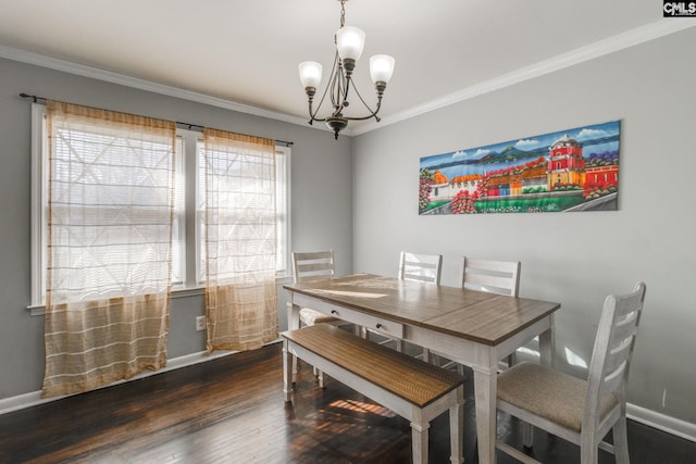 dining space featuring a wealth of natural light, dark hardwood / wood-style floors, ornamental molding, and a notable chandelier