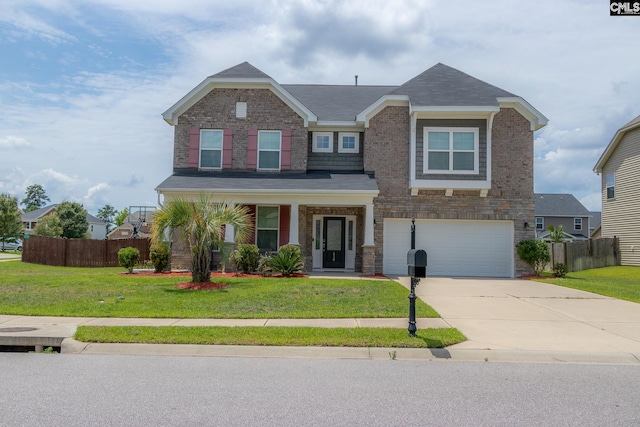 view of front of house featuring a front lawn and fence