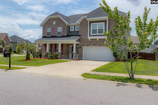 craftsman house featuring a front lawn, a porch, and a garage