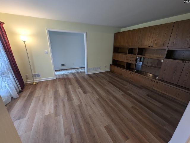 unfurnished living room with light hardwood / wood-style flooring