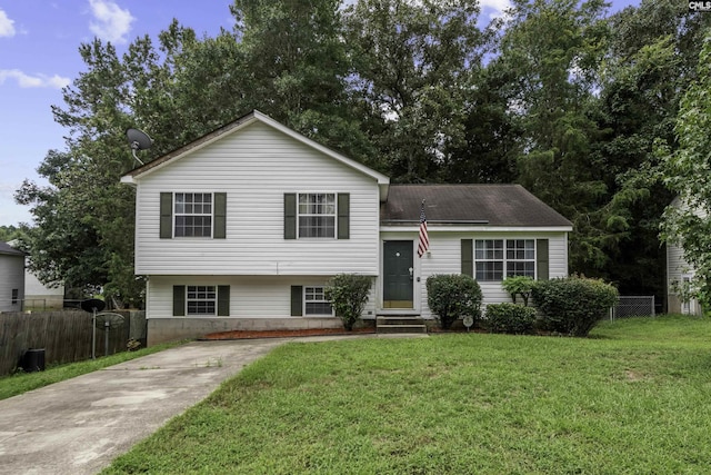 split level home with a front lawn