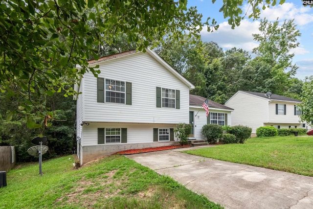 tri-level home with a front lawn