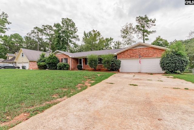 single story home featuring a garage and a front lawn