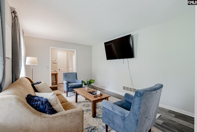 living room with dark wood-type flooring