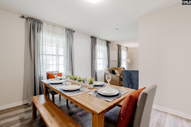 dining area with hardwood / wood-style floors