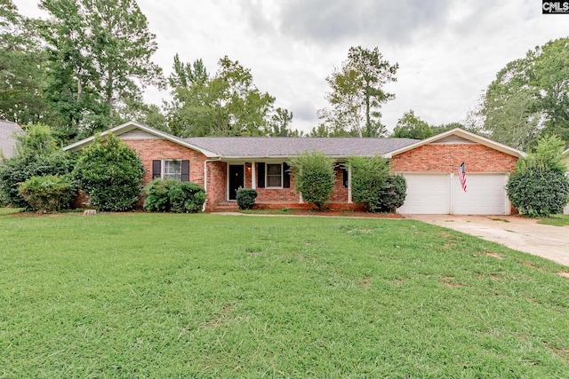 single story home featuring a garage and a front lawn