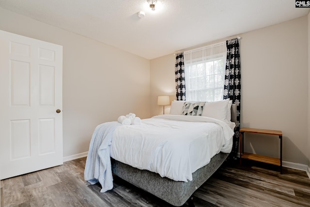 bedroom featuring hardwood / wood-style floors