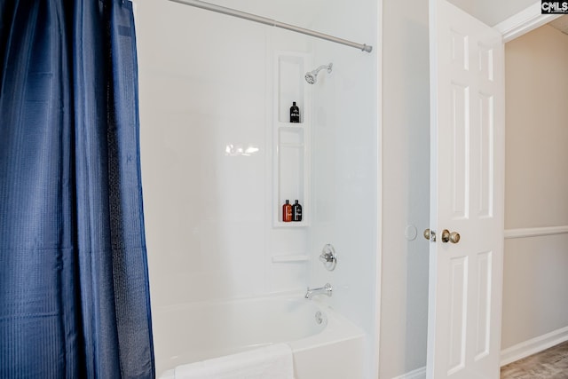 bathroom featuring shower / tub combo with curtain