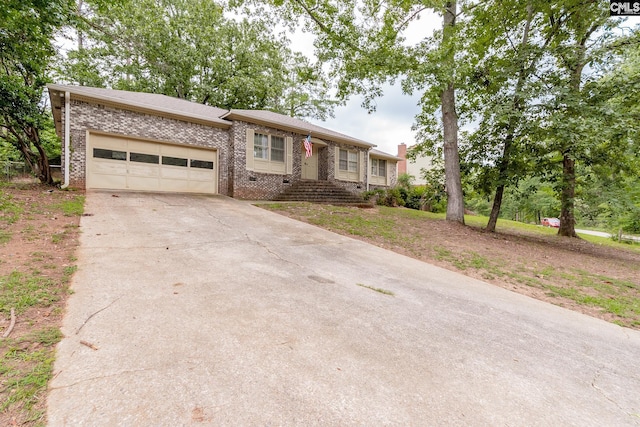 ranch-style house featuring a garage