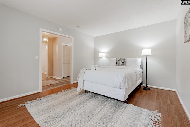 bedroom featuring wood-type flooring