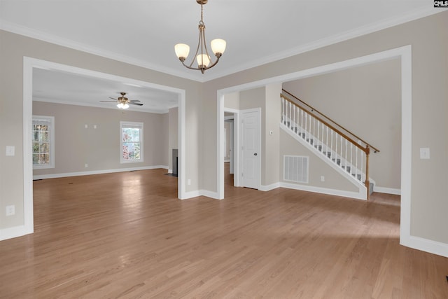 unfurnished living room featuring ceiling fan with notable chandelier, light hardwood / wood-style flooring, and ornamental molding