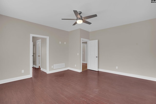 unfurnished bedroom featuring dark wood-type flooring and ceiling fan