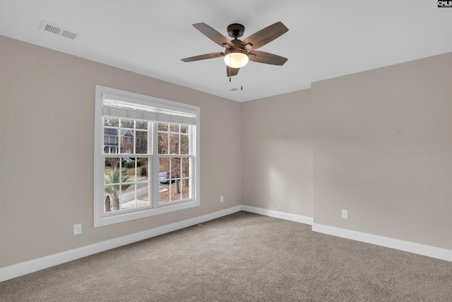 carpeted empty room with ceiling fan