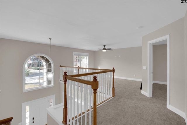 hallway featuring carpet flooring