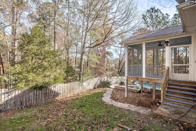 view of yard featuring a sunroom