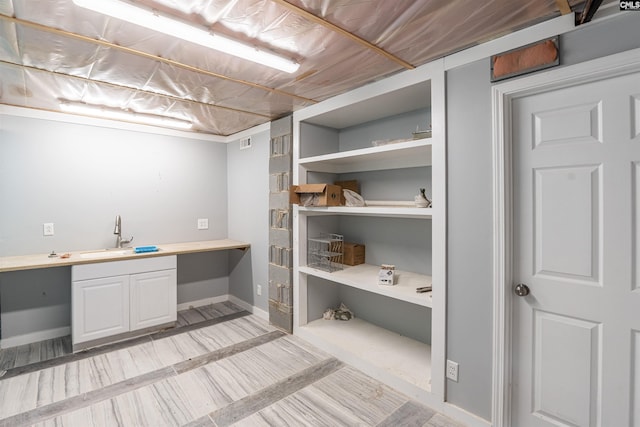 clothes washing area with sink