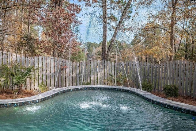 view of swimming pool featuring pool water feature