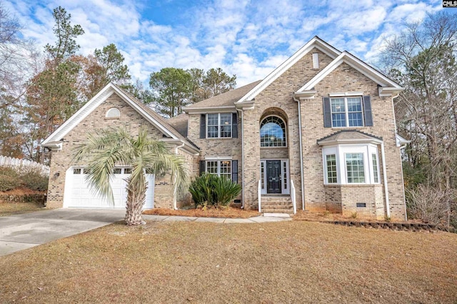 view of front of house with a garage and a front lawn