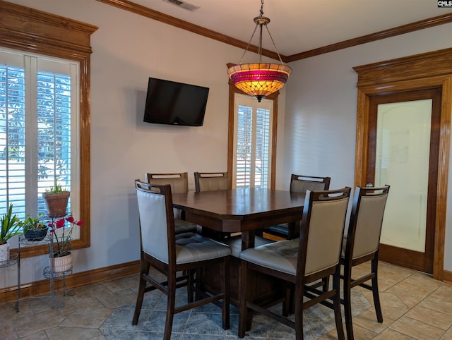 dining room featuring ornamental molding