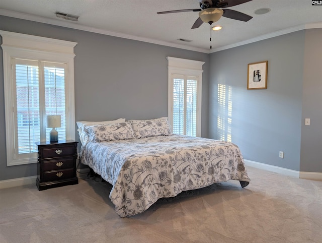 bedroom with ceiling fan, multiple windows, crown molding, and light carpet