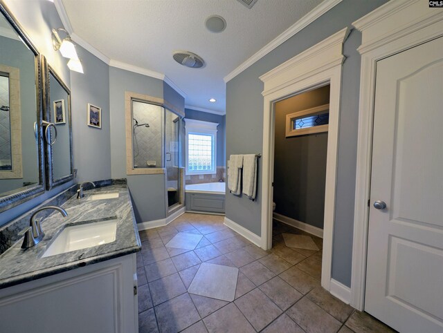 full bathroom featuring vanity, shower with separate bathtub, tile patterned floors, and crown molding