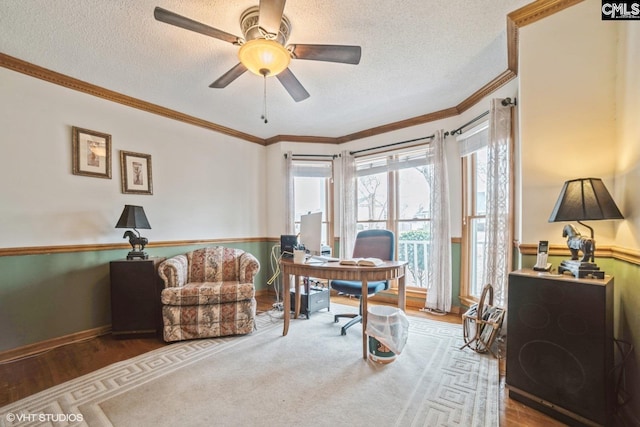 office area with crown molding, ceiling fan, wood-type flooring, and a textured ceiling